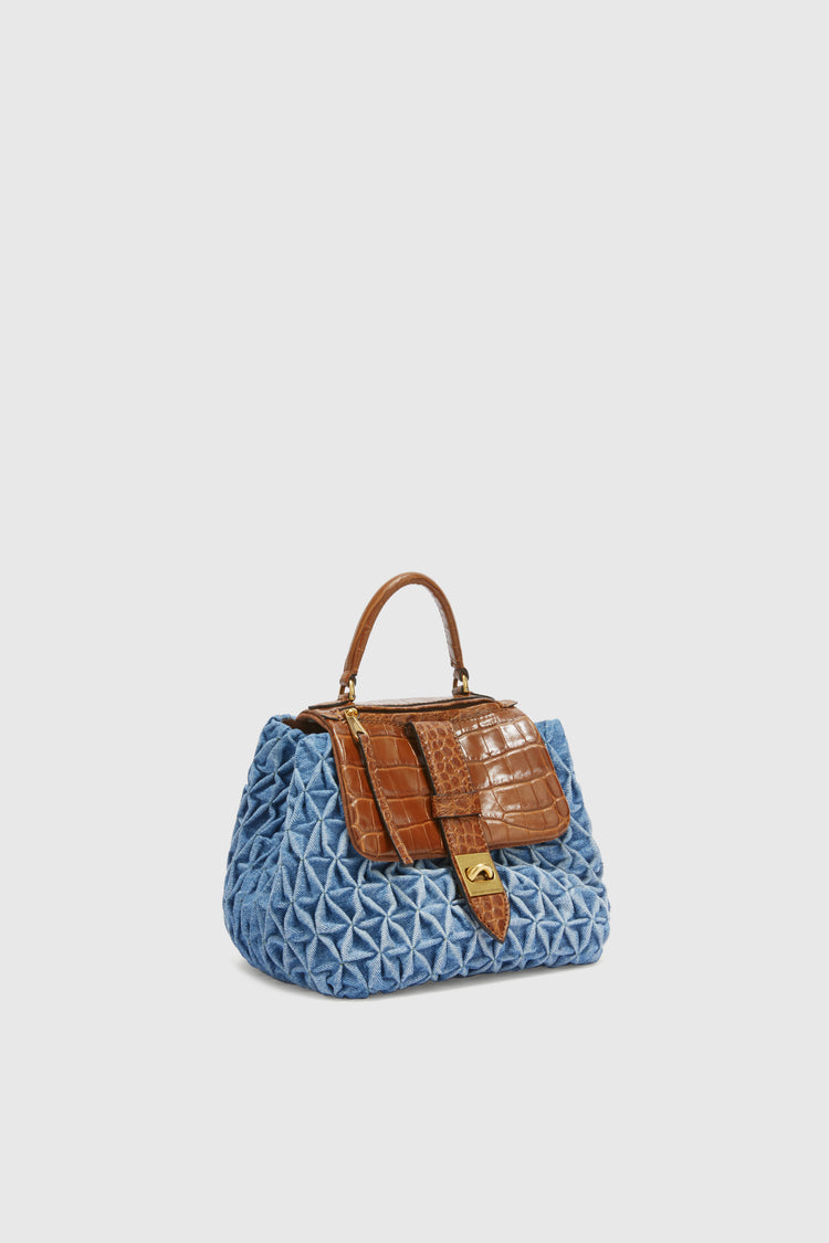 Liza in denim with handmade smock stitching