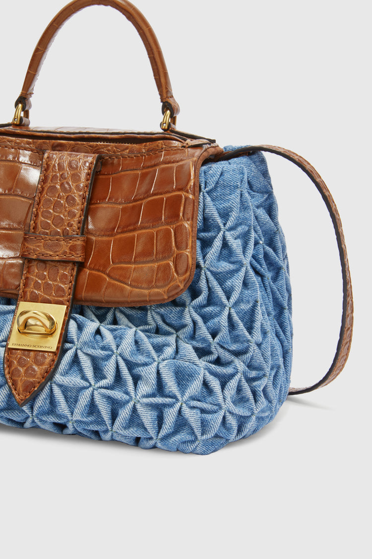 Liza in denim with handmade smock stitching