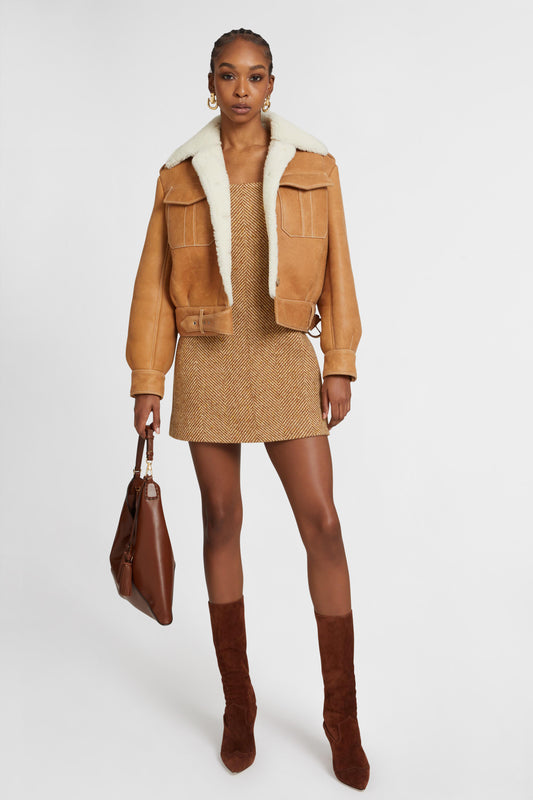 Giacca monopetto in shearling con tasche frontali