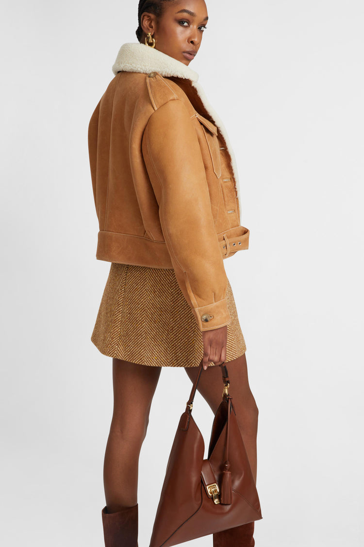Single-breasted shearling jacket with front pockets
