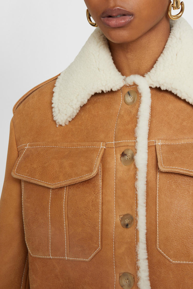 Single-breasted shearling jacket with front pockets