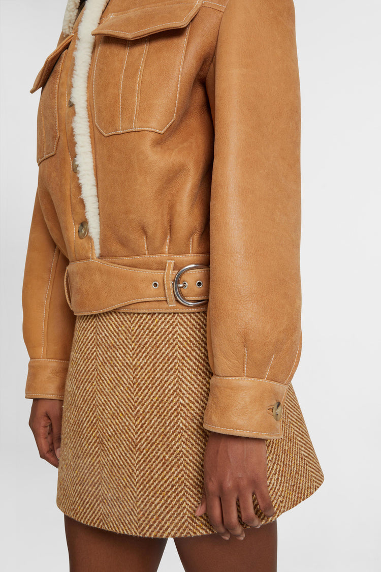 Single-breasted shearling jacket with front pockets