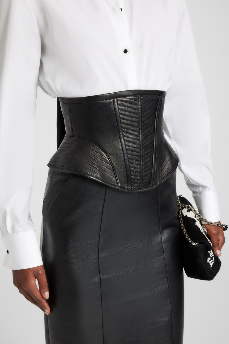 Leather corset with braided straps and sculptural hip structure