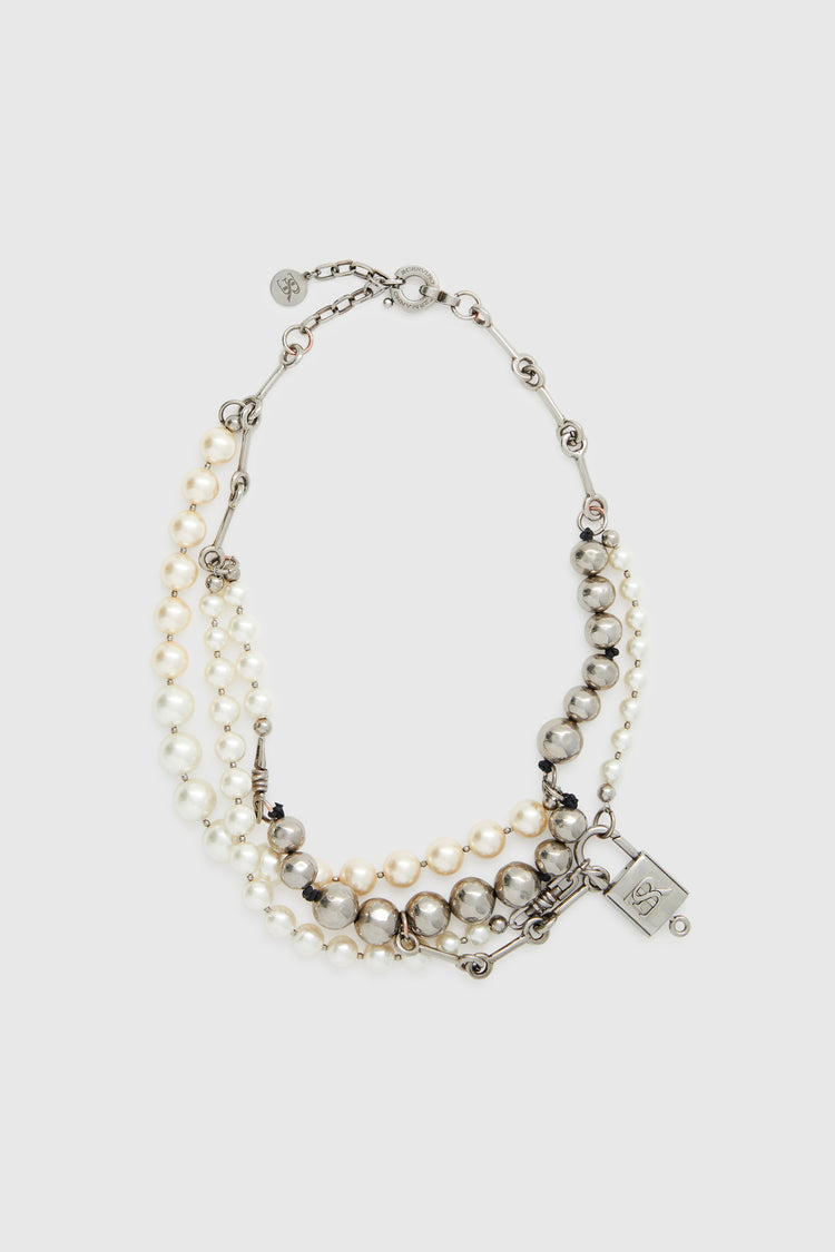 Multi-strand necklace with mix of pearls, glass, and hand-hammered metal beads - silver tone