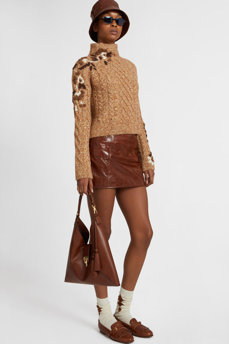 Pure cashmere sweater with braids and three-dimensional floral embroidery made by hand