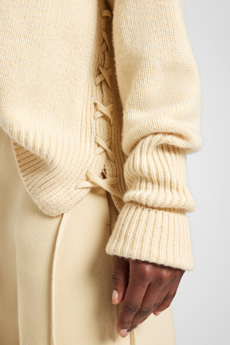 Pure cashmere sweater with handcrafted braiding