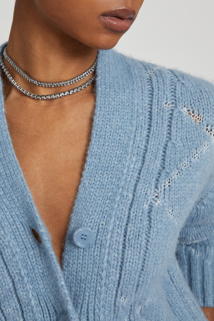 Cardigan en mélange d'alpaga et de mérinos avec motif losanges et logo en microcristaux