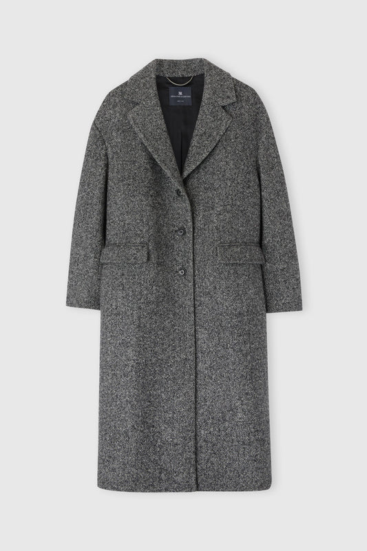 Single-breasted tailored coat with a masculine fit and belt at the waist