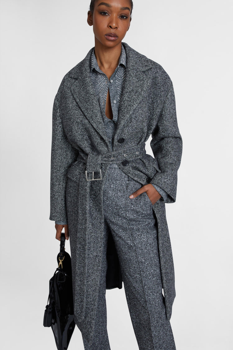 Single-breasted tailored coat with a masculine fit and belt at the waist