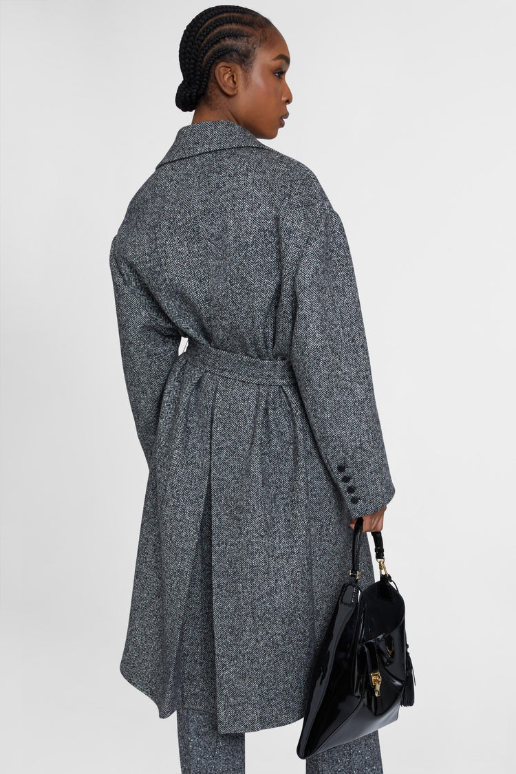 Single-breasted tailored coat with a masculine fit and belt at the waist