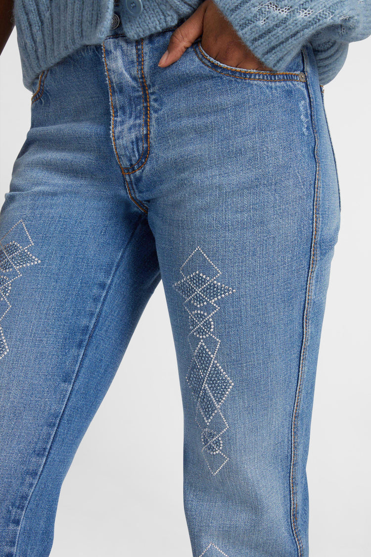 Five-pocket denim jeans with microcrystals