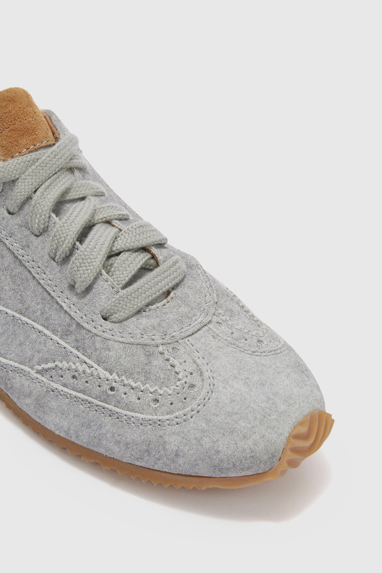 The new Winner sneaker in split leather with cloth effect print and amber rubber sole