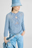 Cashmere sweater with V-neck and daisy appliqués