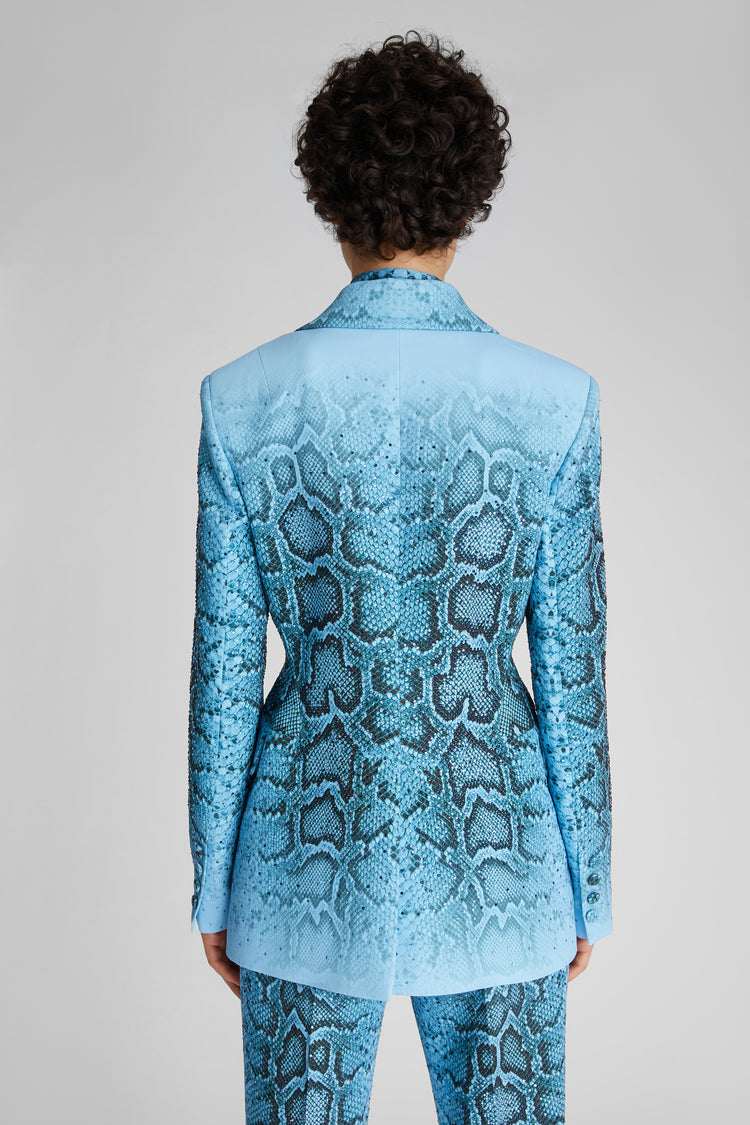 Double-breasted sculpture jacket with python print and crystals.