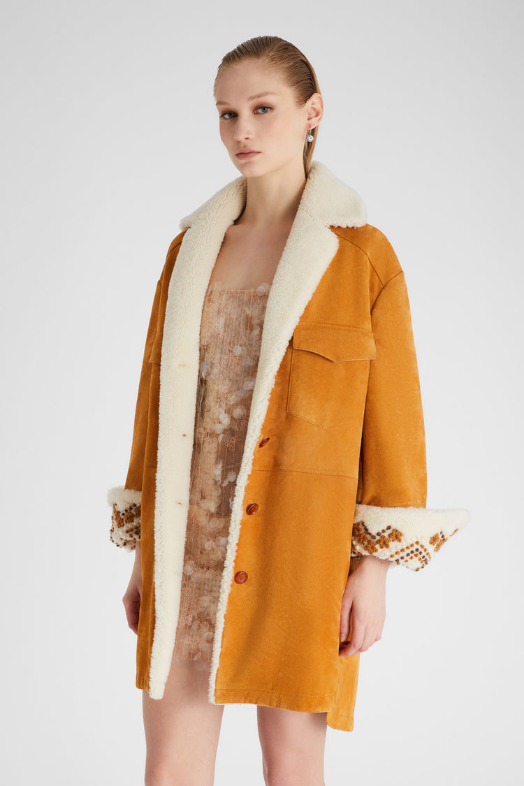 Single-breasted shearling with hand-embroidered sleeve