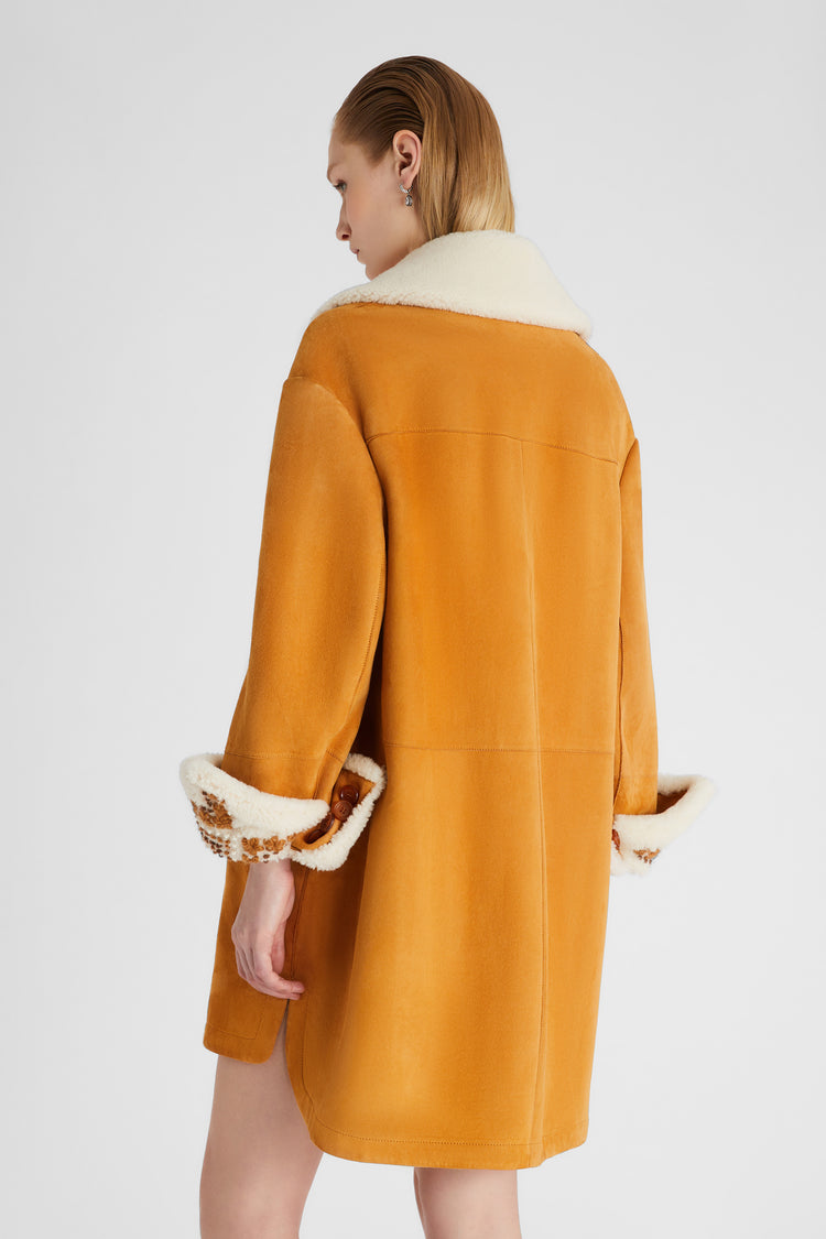 Single-breasted shearling with hand-embroidered sleeve