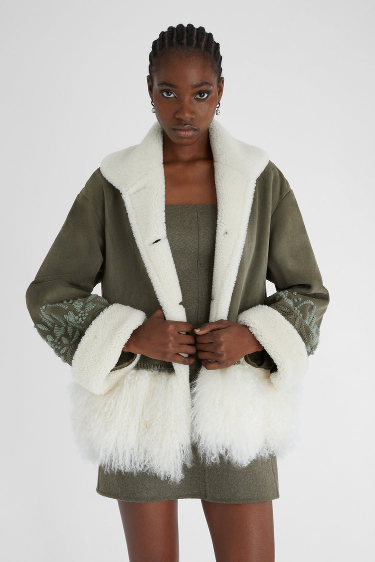 Single-breasted shearling with hand embroidery and fur on the bottom