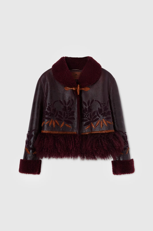 Short single-breasted shearling with handmade embroidery and fur on the bottom