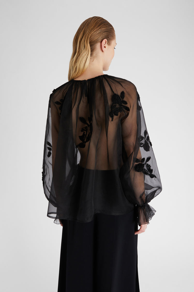 Blusa in organza con applicazioni pizzo