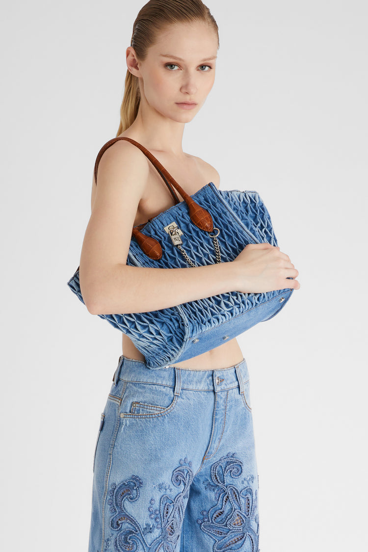 Maggie Media in denim with handmade smock stitch work