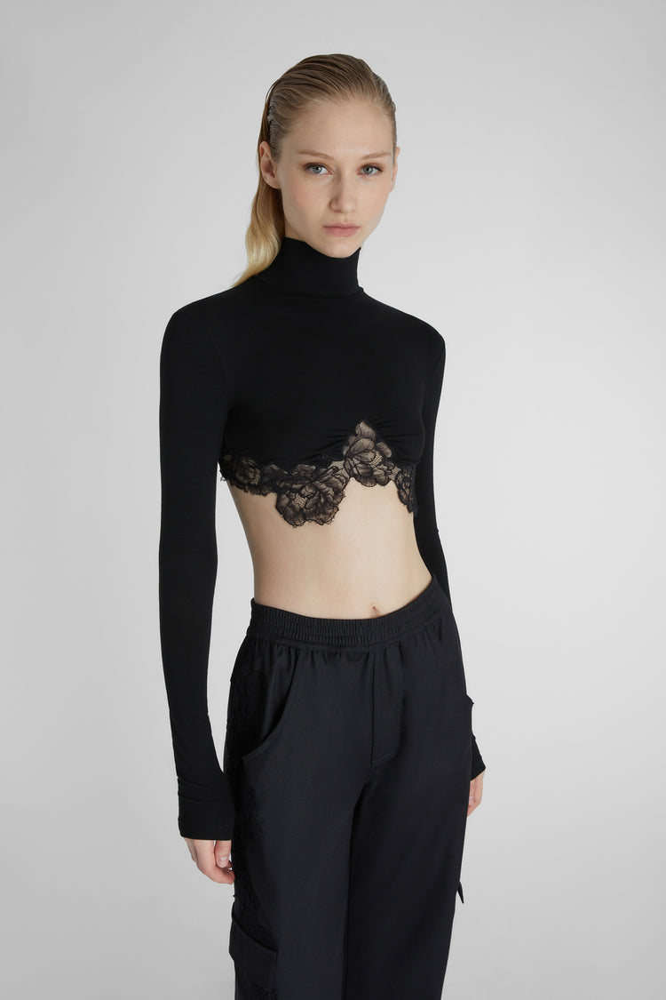 Cropped top with high neck and lace.