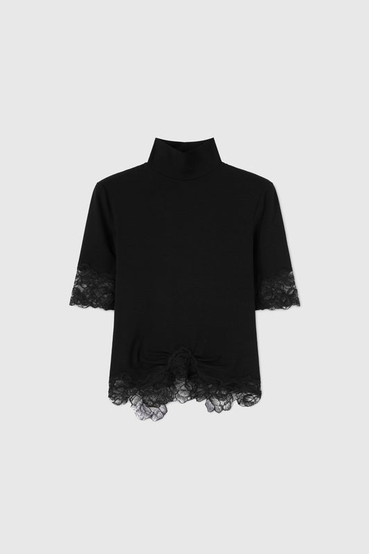 Turtleneck with lace applications.