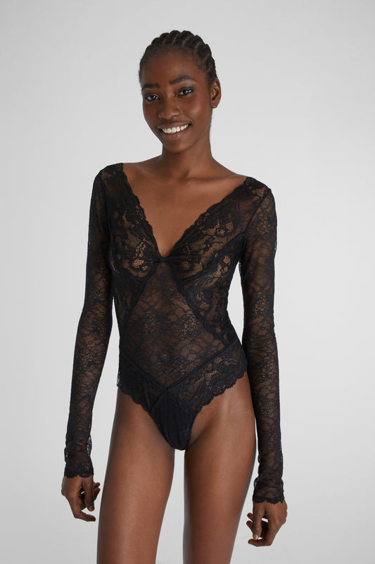 Lace bodysuit with velvet inlays.