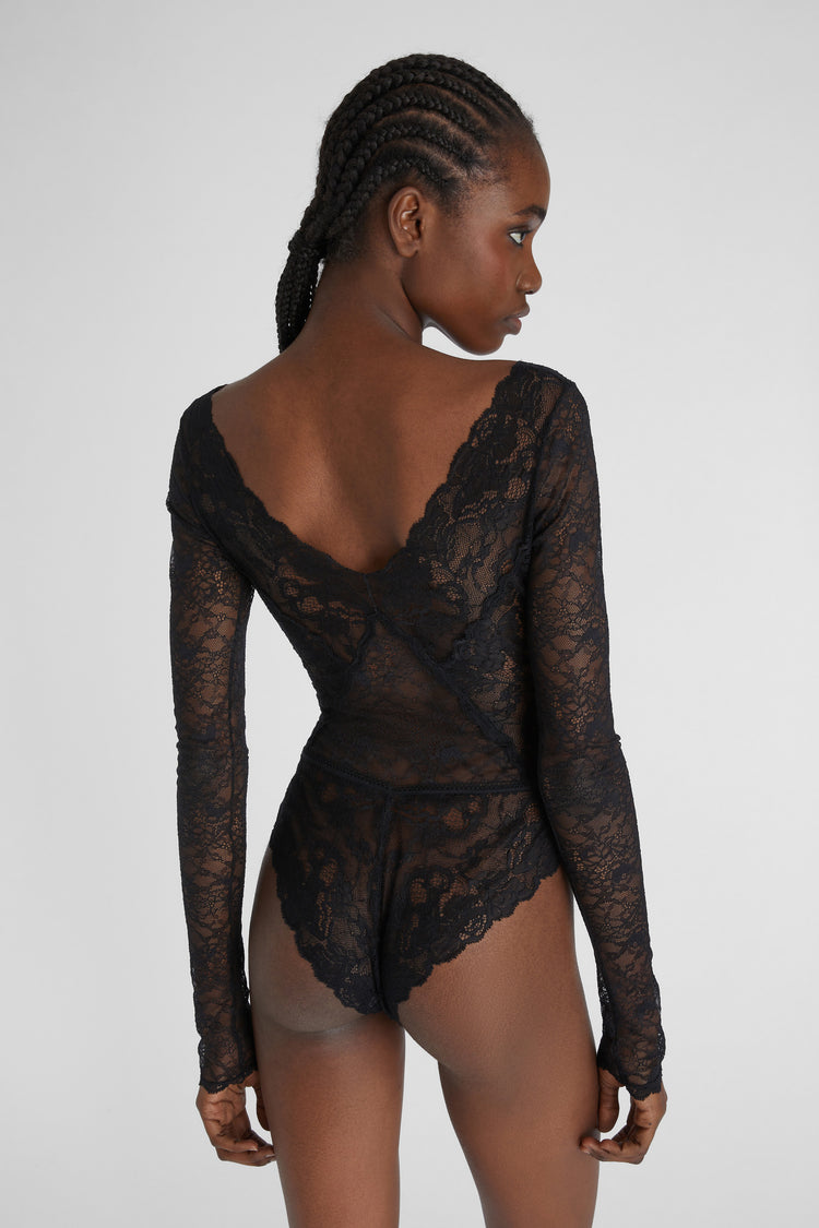 Lace bodysuit with velvet inlays.