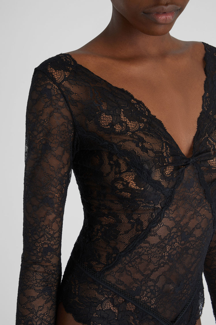 Lace bodysuit with velvet inlays.