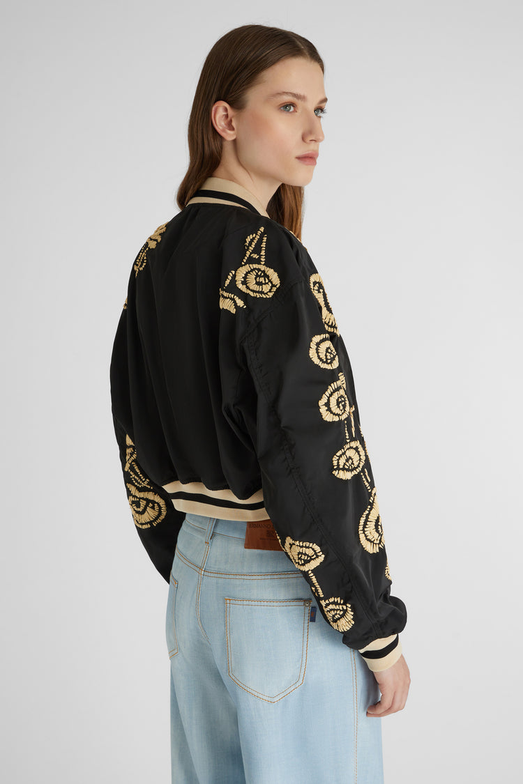 Technical fabric bomber jacket with handmade rafia floral embroidery