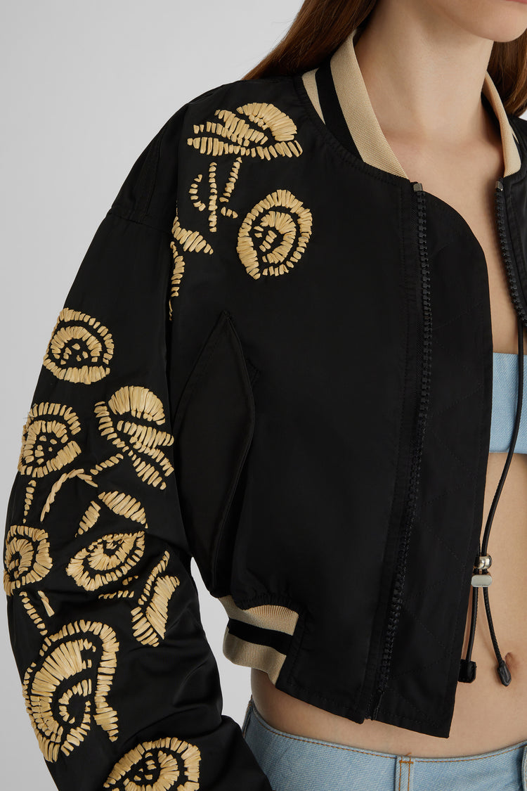 Technical fabric bomber jacket with handmade rafia floral embroidery