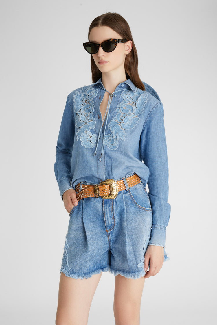 Denim shirt with handmade floral appliqués