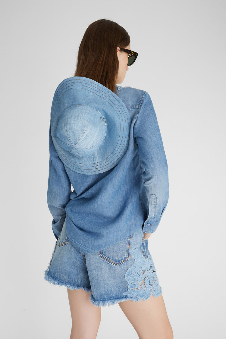 Denim shirt with handmade floral appliqués