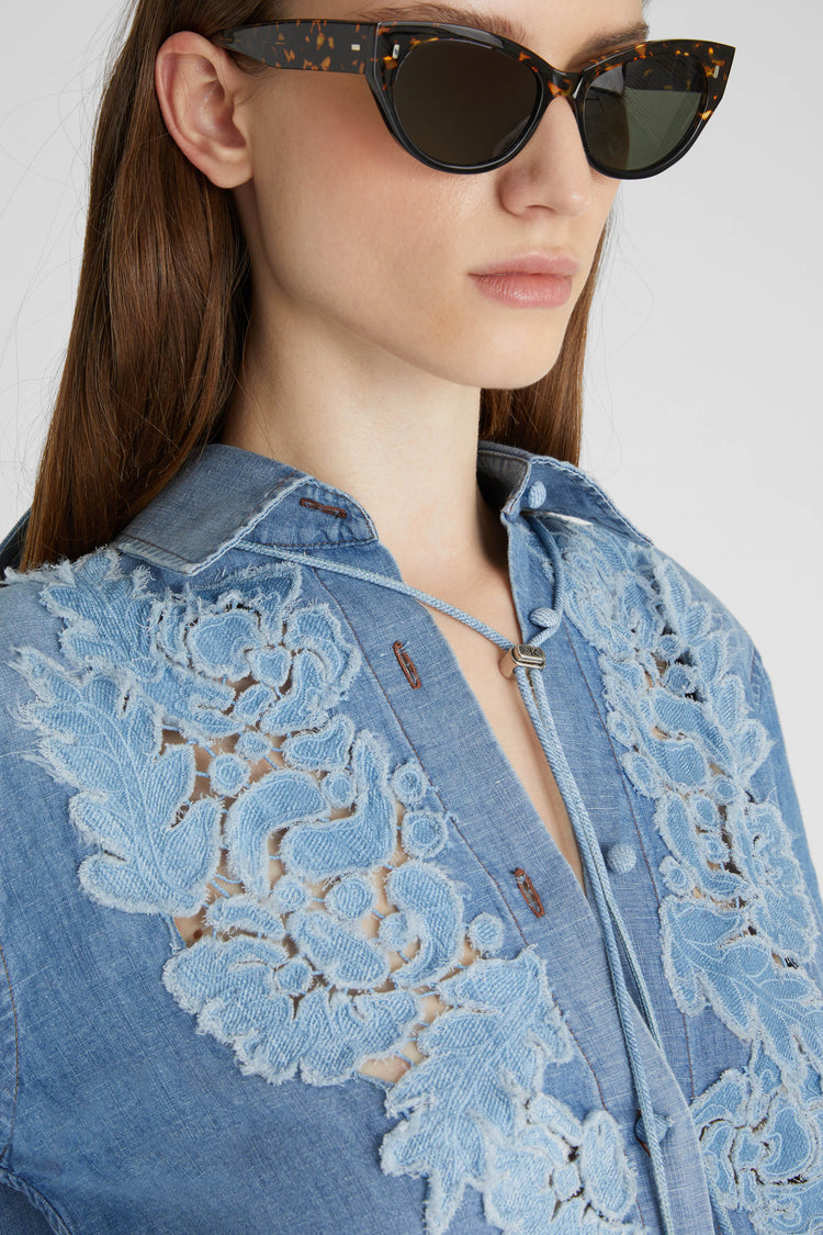 Denim shirt with handmade floral appliqués