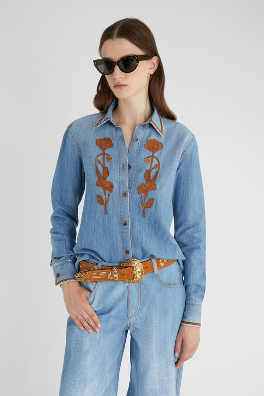 Denim shirt with handmade suede floral appliqué