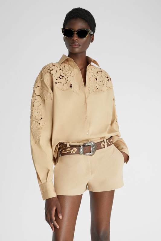 Oversize poplin shirt with handmade floral appliqués