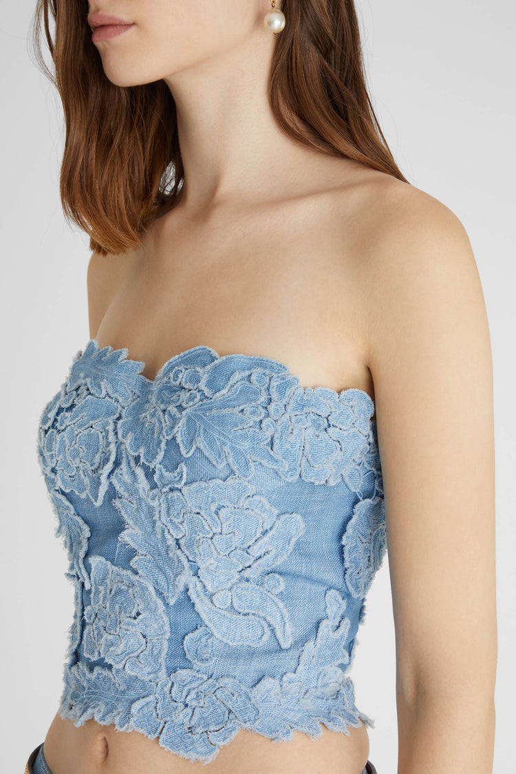 Structured bustier with handmade appliqués