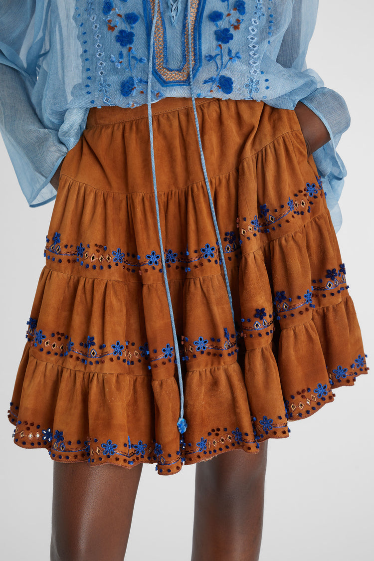 Knee-length flared skirt in suede with handmade floral embroidery