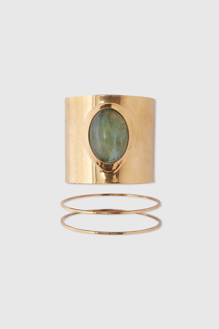 Rigid band bracelet with semi-precious light green hard stone cabouchon