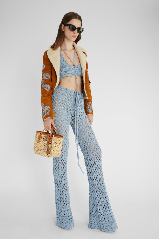 Light blue trousers in pure cotton with hand-made crochet work