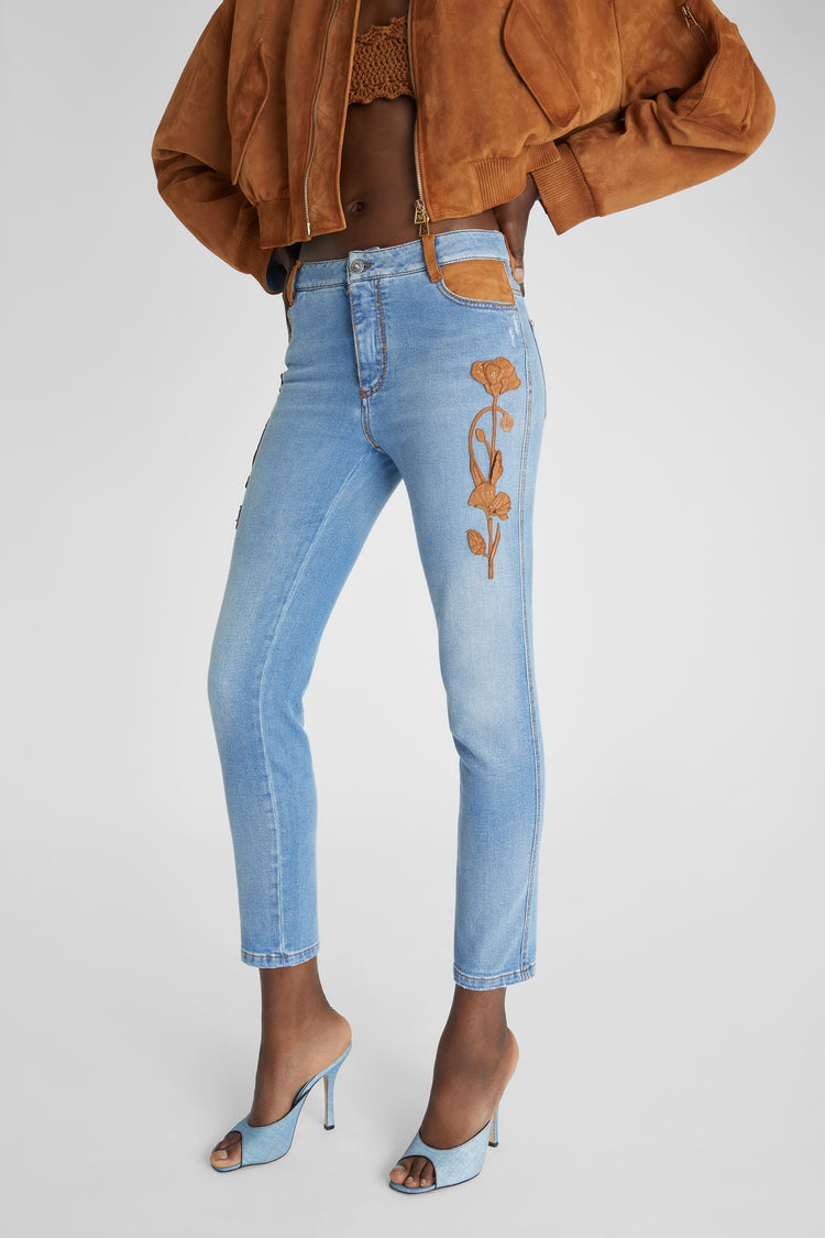 Slim fit jeans with floral details handmade in suede and rafia