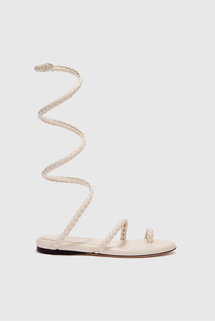 Flat sandal in smooth calfskin with hand-woven lacing