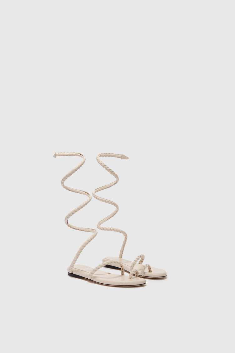 Flat sandal in smooth calfskin with hand-woven lacing