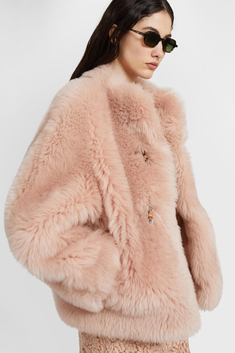 Lambskin leather over jacket with leather and gold metal details.