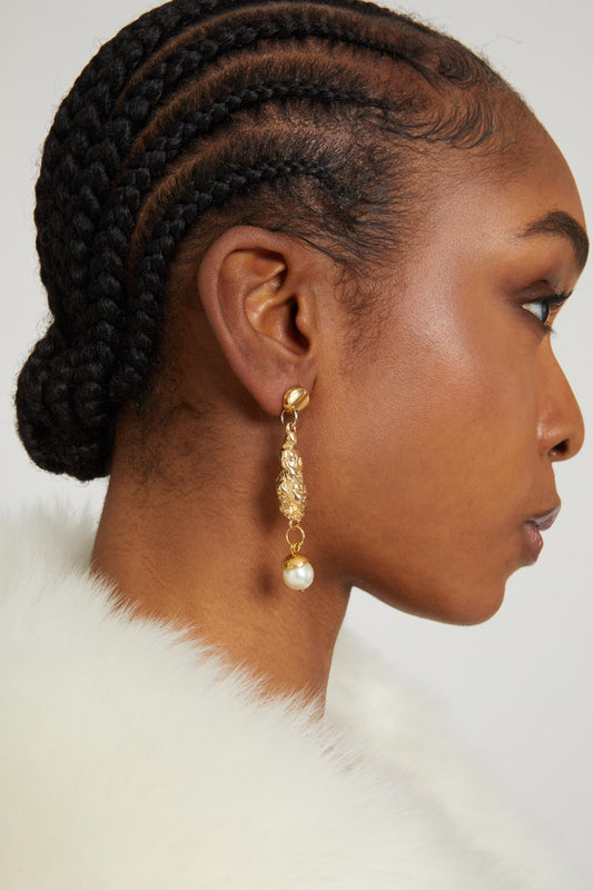 Earrings with sculptural pendants and pearls