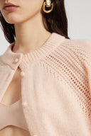 Cropped cardigan in pure cashmere with covered buttons and jour stitching