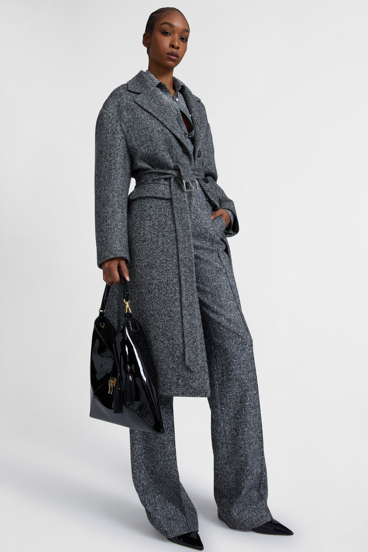 Single-breasted tailored coat with a masculine fit and belt at the waist
