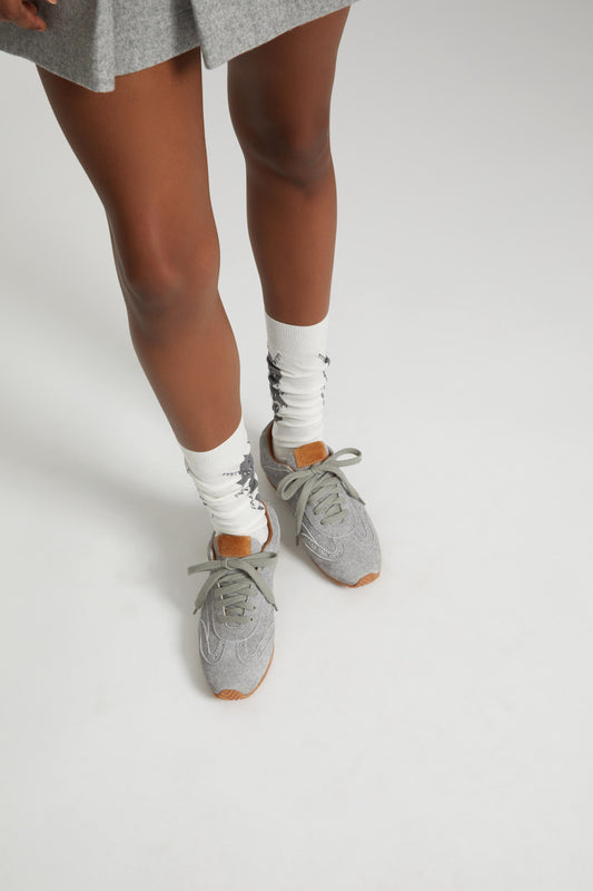 The new Winner sneaker in split leather with cloth effect print and amber rubber sole