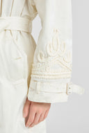 Double-breasted technical trench with hand-finished detailing