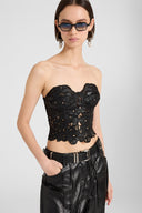 Strapless lambskin leather bustier top with hand-cut floral motif